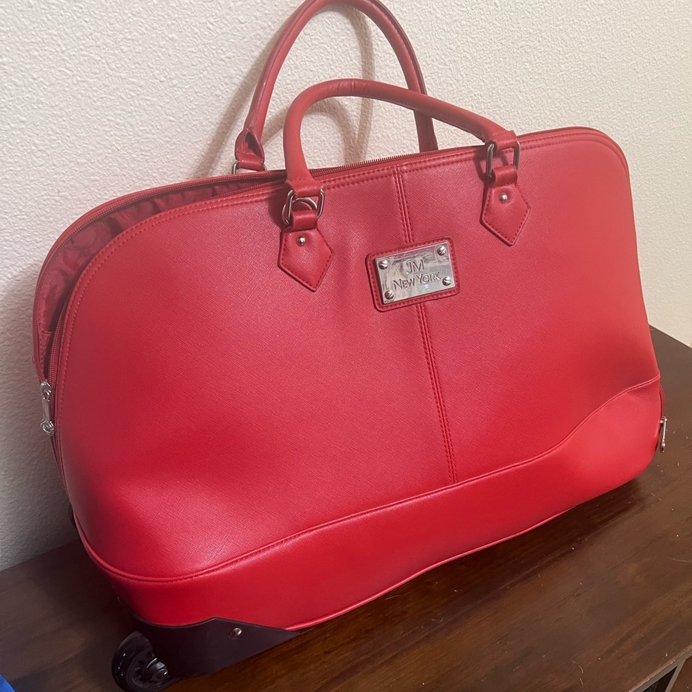 JM New York Red luggage bag